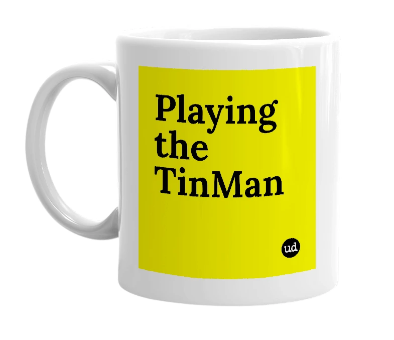 White mug with 'Playing the TinMan' in bold black letters