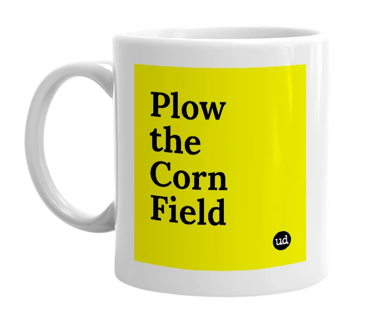 White mug with 'Plow the Corn Field' in bold black letters