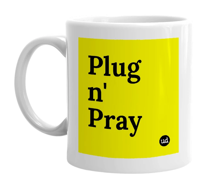 White mug with 'Plug n' Pray' in bold black letters