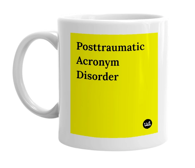 White mug with 'Posttraumatic Acronym Disorder' in bold black letters