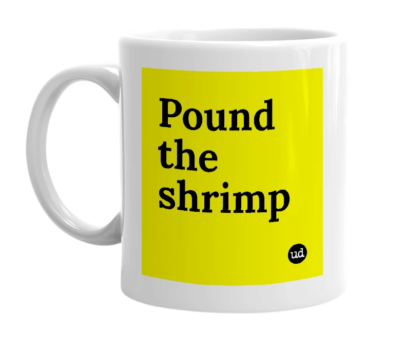 White mug with 'Pound the shrimp' in bold black letters