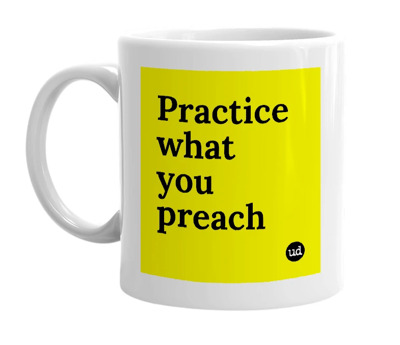 White mug with 'Practice what you preach' in bold black letters