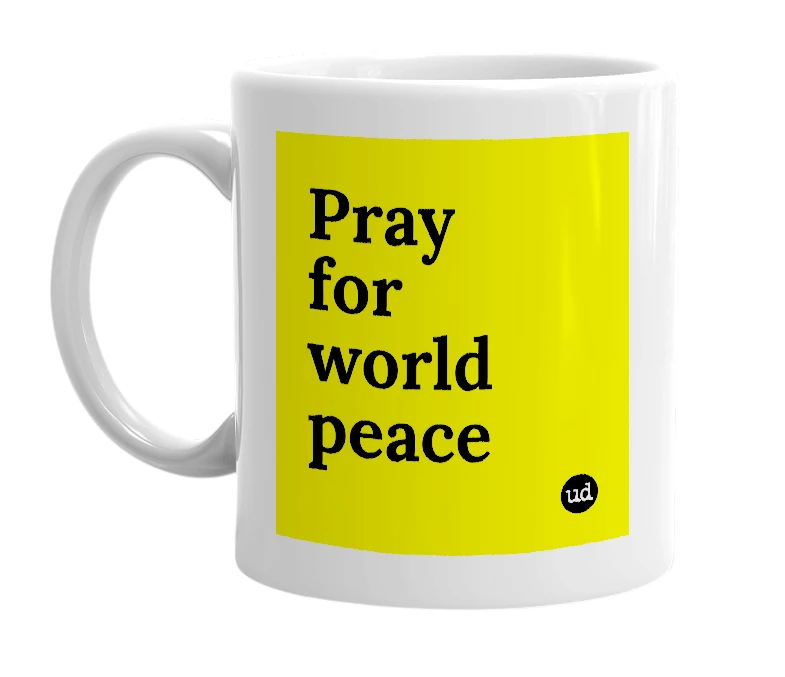 White mug with 'Pray for world peace' in bold black letters