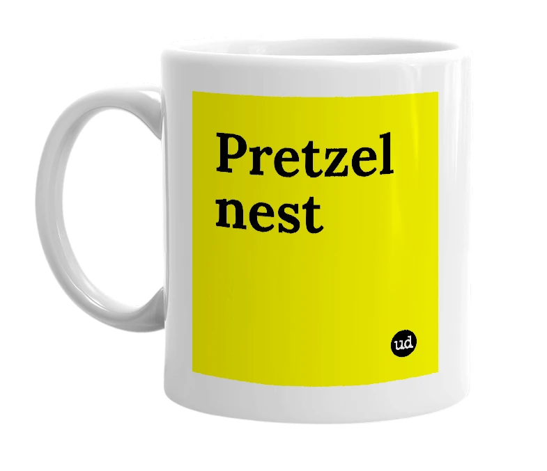 White mug with 'Pretzel nest' in bold black letters