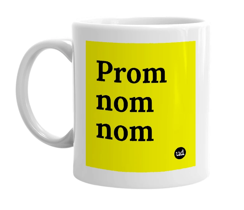 White mug with 'Prom nom nom' in bold black letters