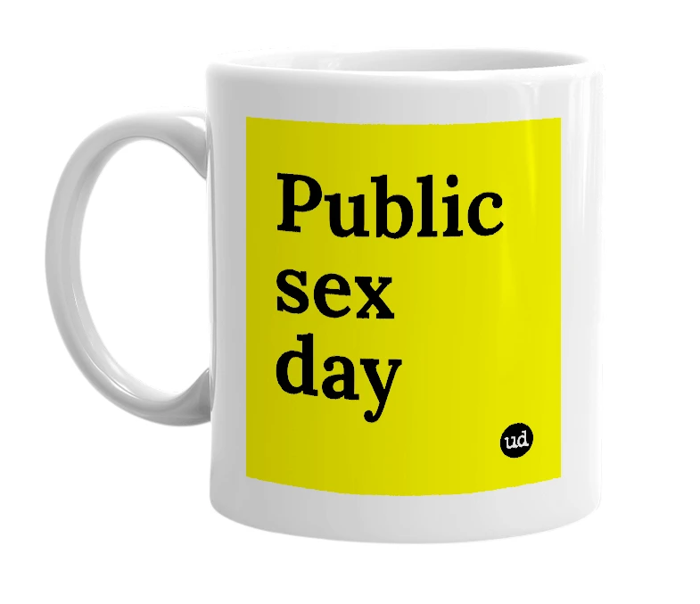 White mug with 'Public sex day' in bold black letters