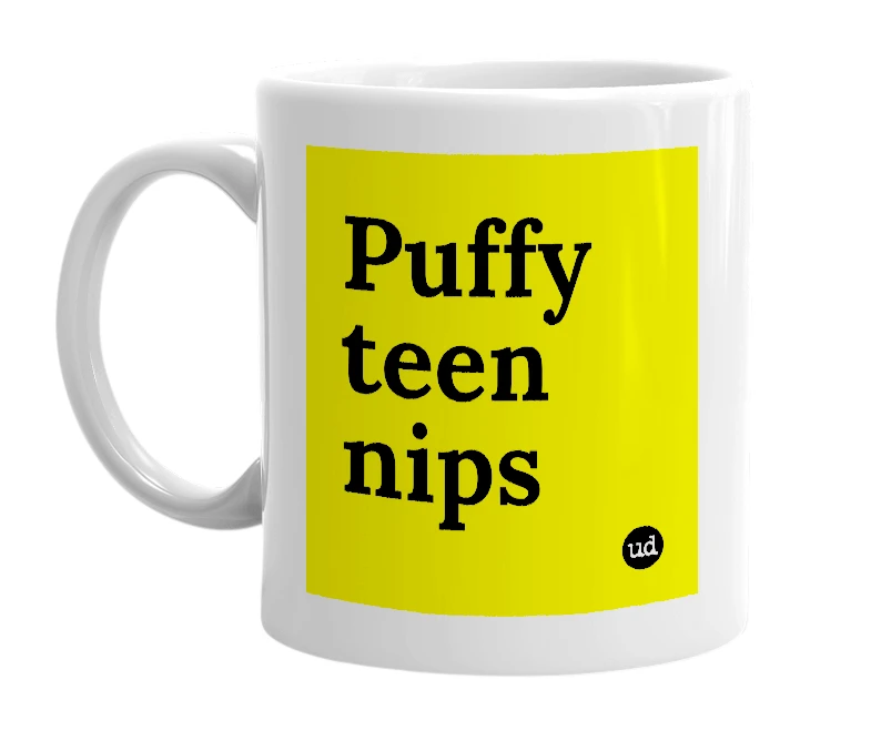 White mug with 'Puffy teen nips' in bold black letters