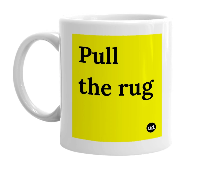 White mug with 'Pull the rug' in bold black letters