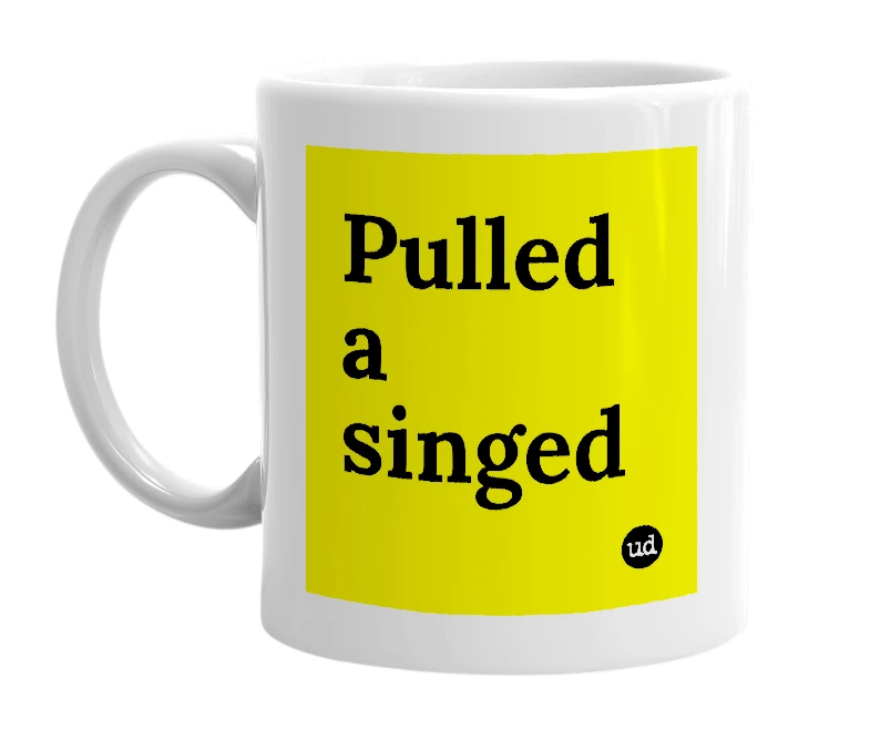 White mug with 'Pulled a singed' in bold black letters