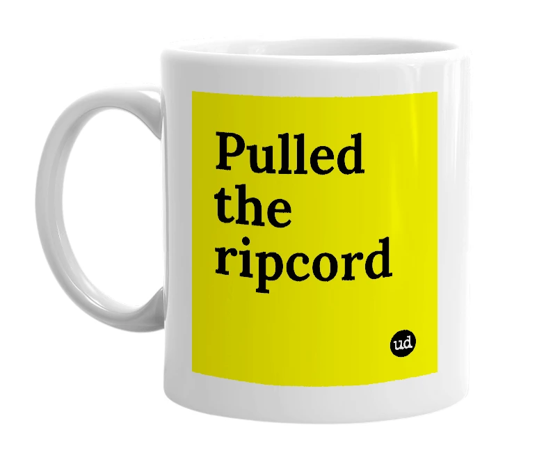 White mug with 'Pulled the ripcord' in bold black letters