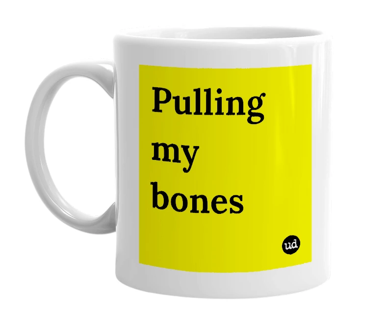 White mug with 'Pulling my bones' in bold black letters