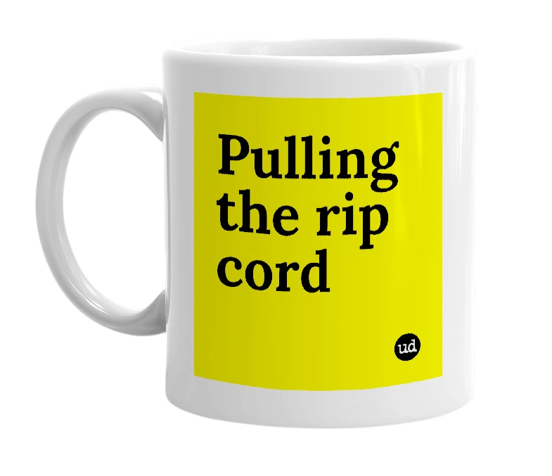 White mug with 'Pulling the rip cord' in bold black letters