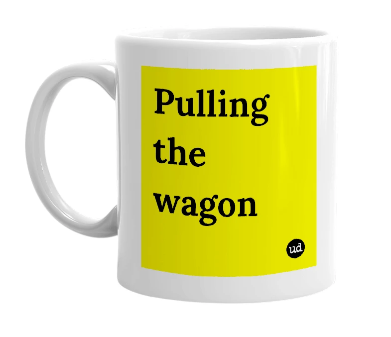 White mug with 'Pulling the wagon' in bold black letters