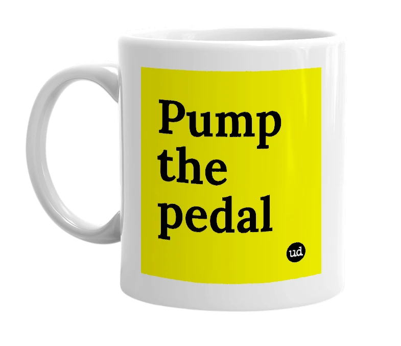 White mug with 'Pump the pedal' in bold black letters