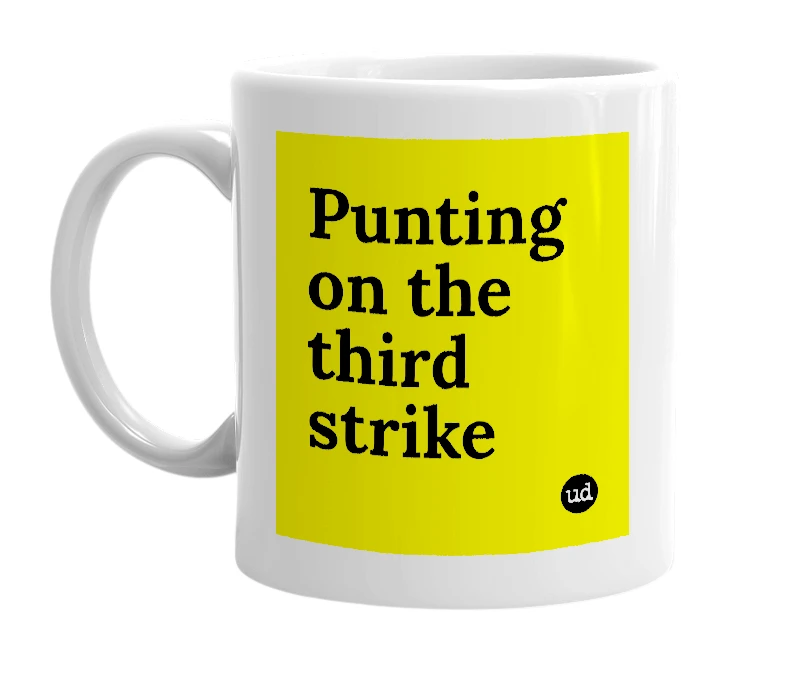 White mug with 'Punting on the third strike' in bold black letters