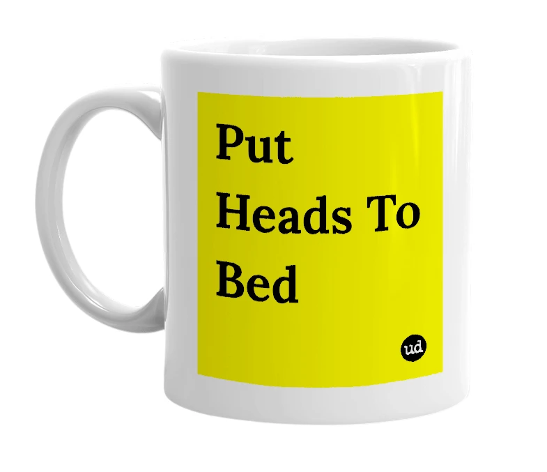 White mug with 'Put Heads To Bed' in bold black letters