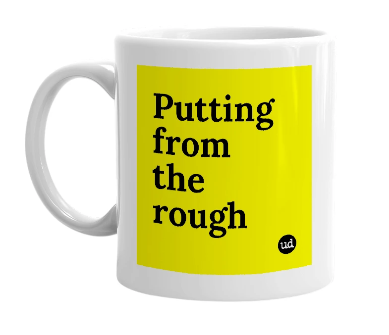 White mug with 'Putting from the rough' in bold black letters