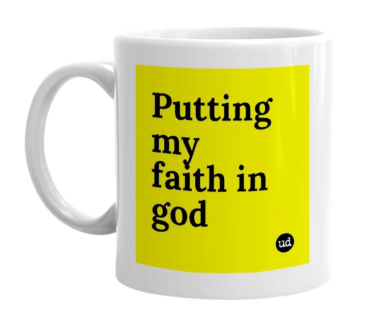 White mug with 'Putting my faith in god' in bold black letters