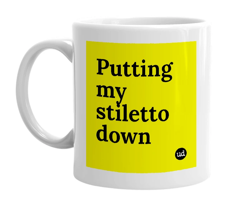 White mug with 'Putting my stiletto down' in bold black letters