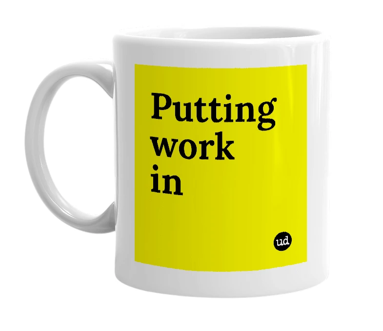White mug with 'Putting work in' in bold black letters