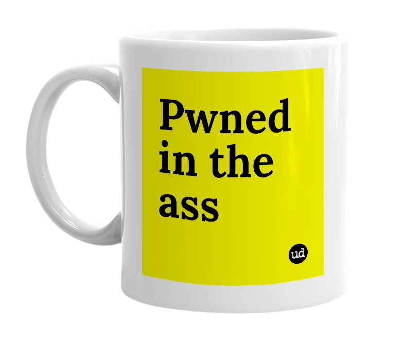 White mug with 'Pwned in the ass' in bold black letters