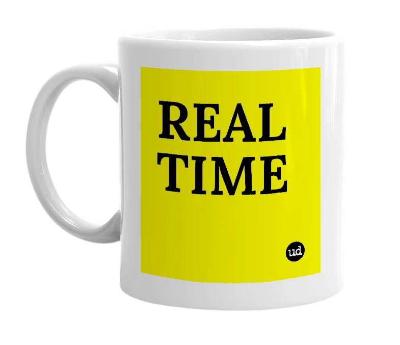 White mug with 'REAL TIME' in bold black letters