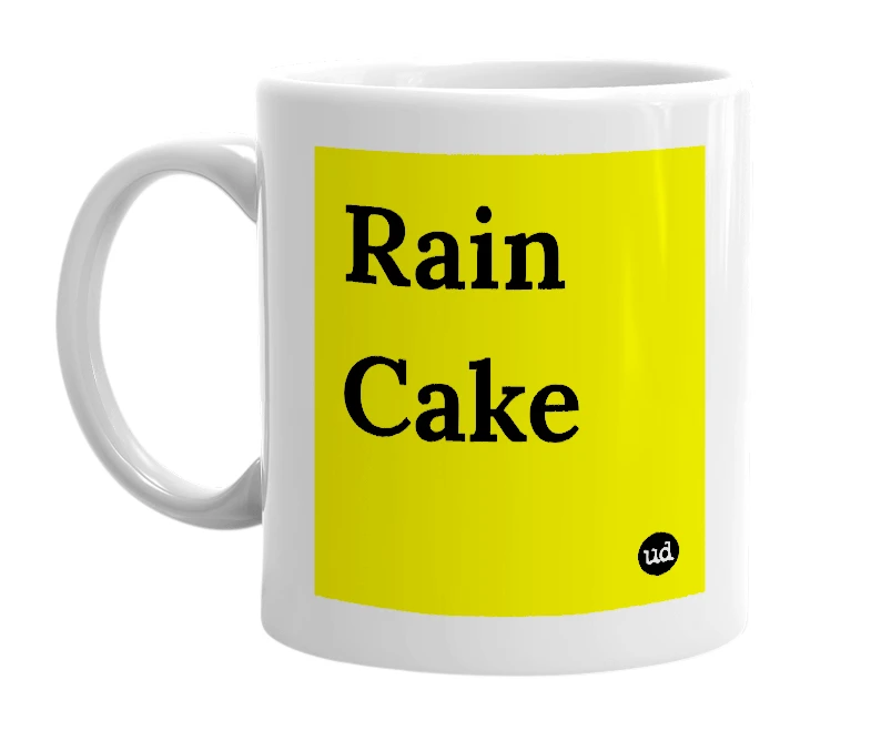 White mug with 'Rain Cake' in bold black letters
