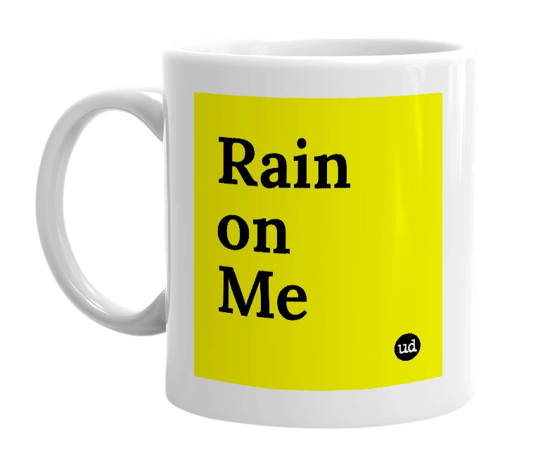 White mug with 'Rain on Me' in bold black letters