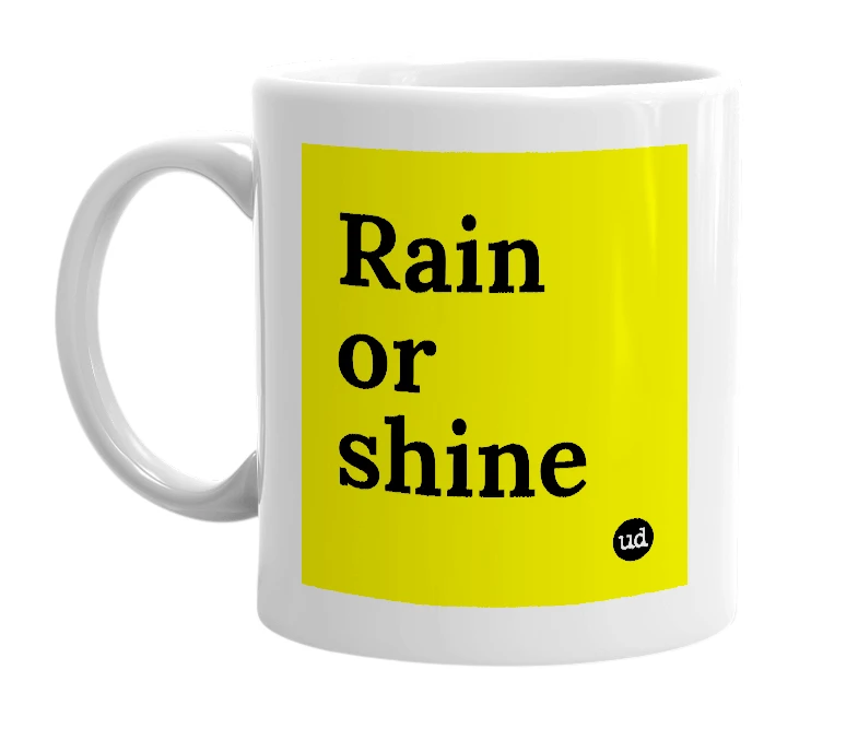 White mug with 'Rain or shine' in bold black letters