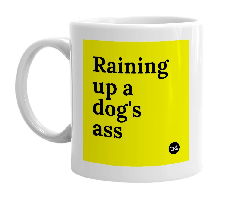 White mug with 'Raining up a dog's ass' in bold black letters