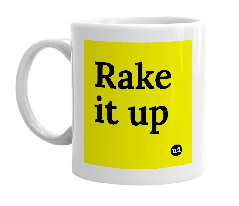 White mug with 'Rake it up' in bold black letters
