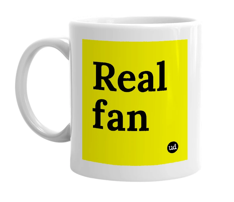 White mug with 'Real fan' in bold black letters