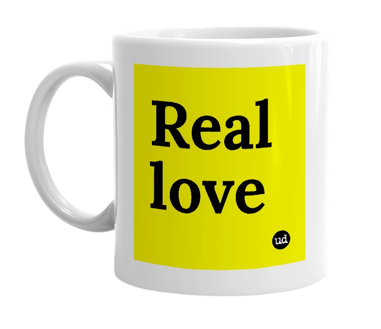 White mug with 'Real love' in bold black letters