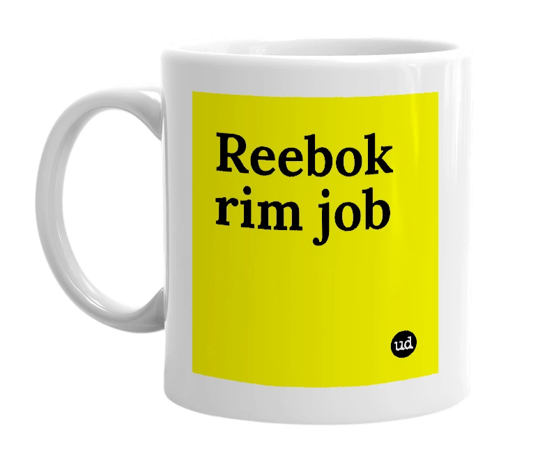 White mug with 'Reebok rim job' in bold black letters