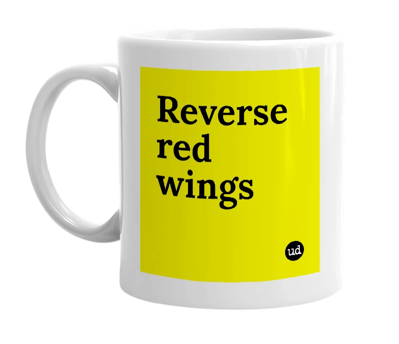 White mug with 'Reverse red wings' in bold black letters