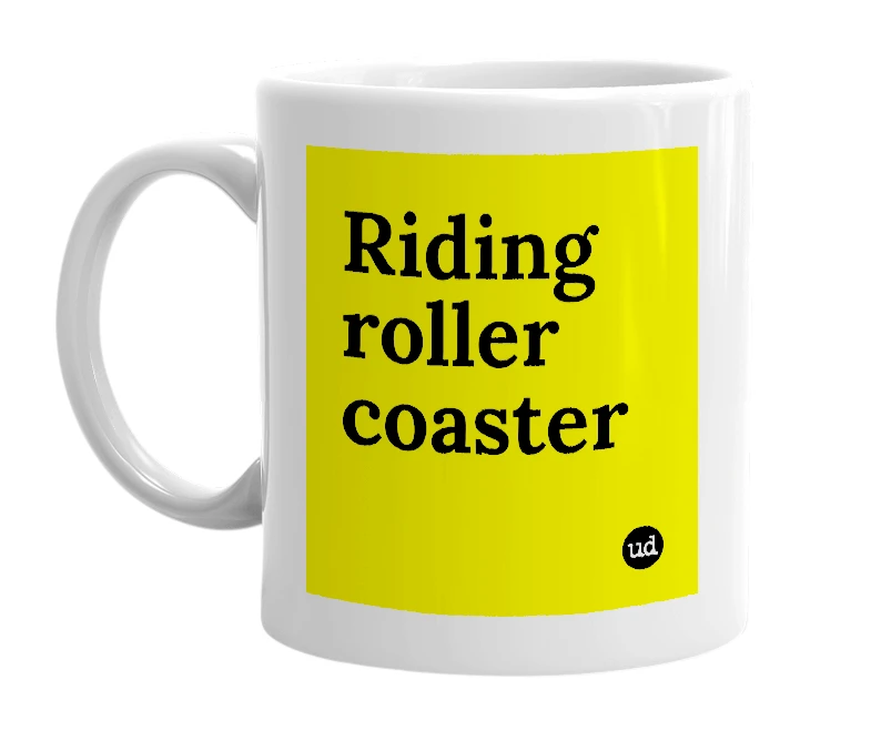 White mug with 'Riding roller coaster' in bold black letters