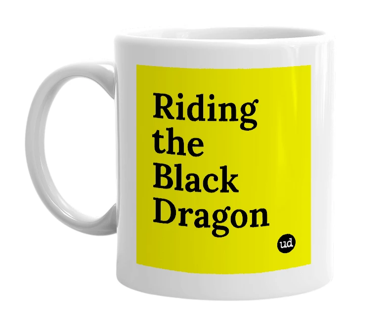 White mug with 'Riding the Black Dragon' in bold black letters