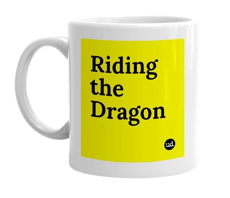 White mug with 'Riding the Dragon' in bold black letters