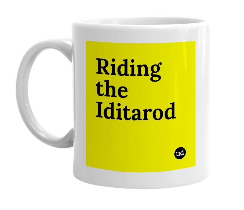 White mug with 'Riding the Iditarod' in bold black letters