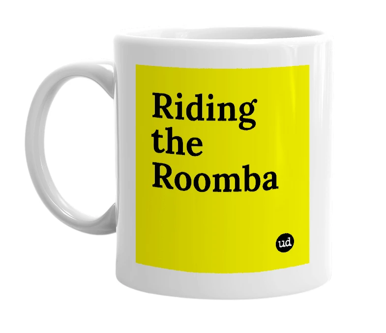 White mug with 'Riding the Roomba' in bold black letters