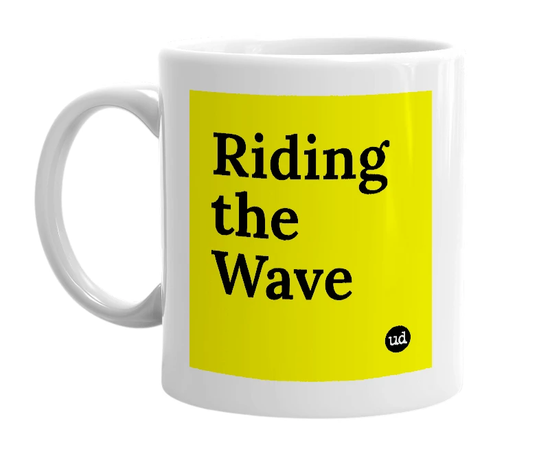 White mug with 'Riding the Wave' in bold black letters