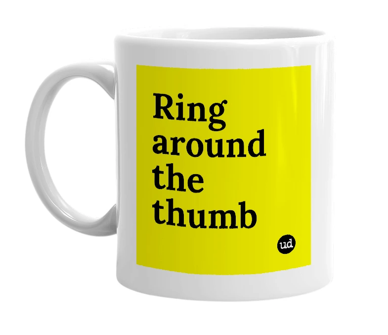 White mug with 'Ring around the thumb' in bold black letters