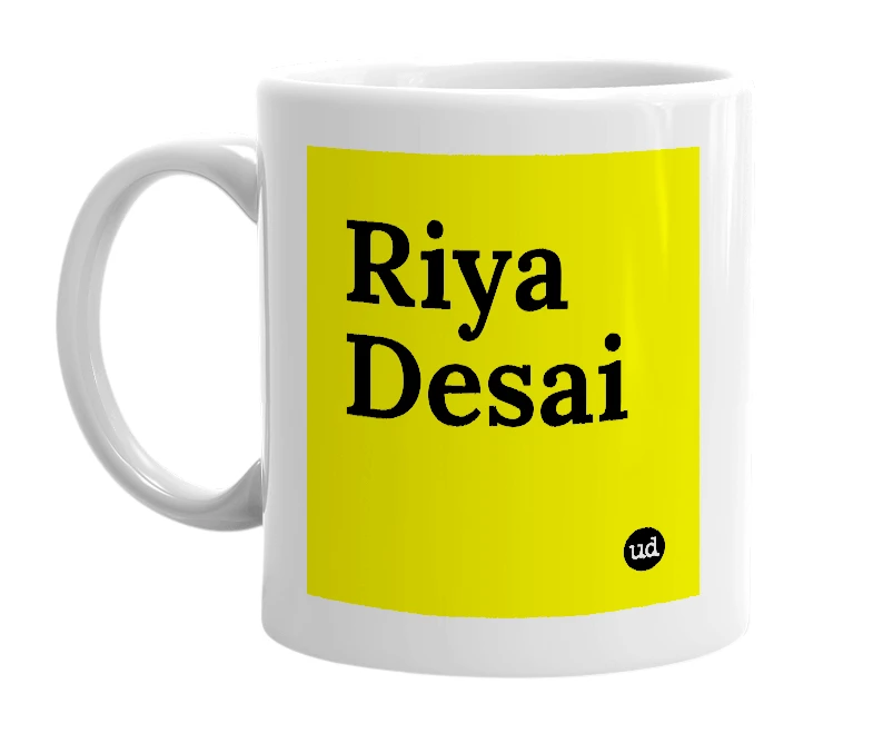 White mug with 'Riya Desai' in bold black letters
