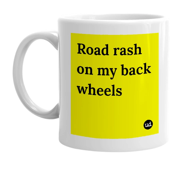 White mug with 'Road rash on my back wheels' in bold black letters