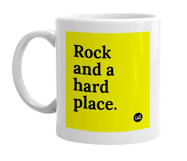 White mug with 'Rock and a hard place.' in bold black letters