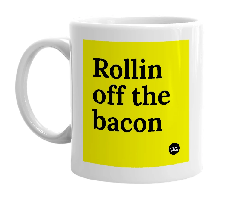 White mug with 'Rollin off the bacon' in bold black letters