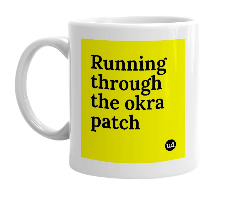 White mug with 'Running through the okra patch' in bold black letters