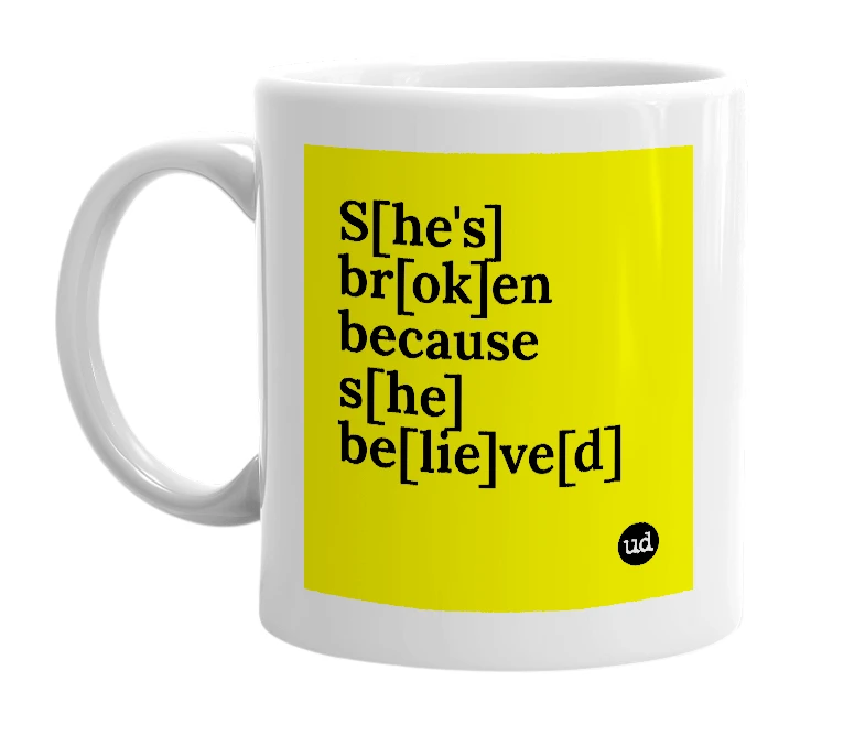 White mug with 'S[he's] br[ok]en because s[he] be[lie]ve[d]' in bold black letters