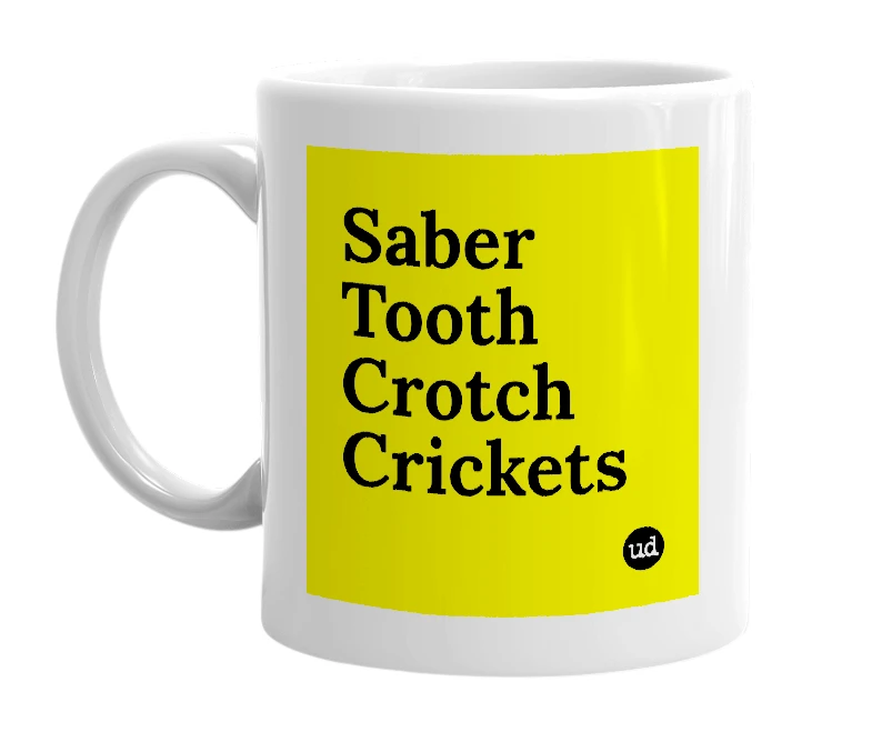 White mug with 'Saber Tooth Crotch Crickets' in bold black letters