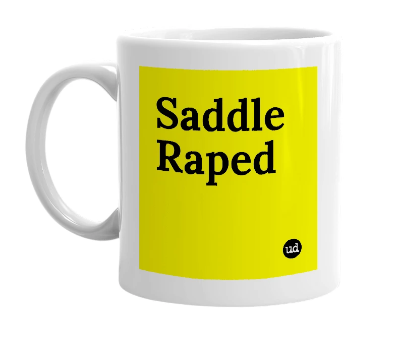 White mug with 'Saddle Raped' in bold black letters